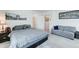 Cozy bedroom featuring a plush bed, sitting area, and artwork at 2315 N 73Rd Dr, Phoenix, AZ 85035