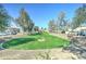 Green common area with mature trees in a well maintained community with ample parking at 2315 N 73Rd Dr, Phoenix, AZ 85035
