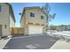 A two-story townhome featuring an attached garage with a private gated outdoor area; perfect blend of comfort and security at 2315 N 73Rd Dr, Phoenix, AZ 85035