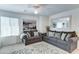 Comfortable living room with gray sofas, decorative pillows, and a patterned area rug at 2315 N 73Rd Dr, Phoenix, AZ 85035