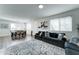 Inviting living room with an open floor plan, comfortable seating, and a view of the dining area and front entrance at 2315 N 73Rd Dr, Phoenix, AZ 85035