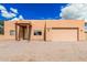 Single-story home with attached garage and xeriscape landscaping at 26015 S Grapefruit Dr, Queen Creek, AZ 85142