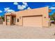Single-story home with wood beam entryway and xeriscape landscaping at 26015 S Grapefruit Dr, Queen Creek, AZ 85142