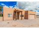 Inviting single-story home with wood beam entryway and xeriscape landscaping at 26015 S Grapefruit Dr, Queen Creek, AZ 85142