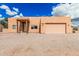 Single-story home with wood beam entryway and xeriscape landscaping at 26015 S Grapefruit Dr, Queen Creek, AZ 85142
