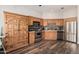 Traditional kitchen featuring wooden cabinets, stainless steel appliances, and a large, rustic armoire at 26015 S Grapefruit Dr, Queen Creek, AZ 85142