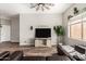 Stylish living room features hardwood floors, ample natural light, and modern furnishings at 26015 S Grapefruit Dr, Queen Creek, AZ 85142