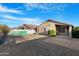 An open backyard with a gravel groundcover, patio and privacy fence at 40335 W Novak Ln, Maricopa, AZ 85138