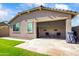 Charming backyard featuring green lawn, an outdoor patio, and privacy wall at 4121 W Bradshaw Creek Ln, New River, AZ 85087