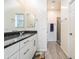 Stylish bathroom featuring granite countertops, modern cabinetry, and a view into the shower at 4121 W Bradshaw Creek Ln, New River, AZ 85087