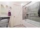 Updated bathroom features a shower-over-tub with gray tile and a modern shower head at 4121 W Bradshaw Creek Ln, New River, AZ 85087
