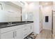 Bathroom features granite countertops, double sinks, modern cabinetry, and tile flooring at 4121 W Bradshaw Creek Ln, New River, AZ 85087