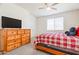 Bedroom with ceiling fan, large dresser, and neutral carpet at 4121 W Bradshaw Creek Ln, New River, AZ 85087