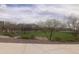 Well-manicured community park featuring mature trees and lush green space for relaxation and recreation at 4121 W Bradshaw Creek Ln, New River, AZ 85087
