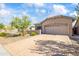 This well-manicured home features stone accents and desert-friendly landscaping and a paved driveway at 4121 W Bradshaw Creek Ln, New River, AZ 85087