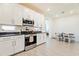 Contemporary kitchen with stainless steel appliances, ample counter space, and a bright dining area at 4121 W Bradshaw Creek Ln, New River, AZ 85087