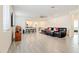 Bright and spacious living room with tile floors and contemporary furnishings at 4121 W Bradshaw Creek Ln, New River, AZ 85087