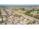 Expansive aerial view of homes with solar panels and community green spaces at 41734 N Cielito Linda Way, San Tan Valley, AZ 85140