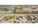 Aerial view of homes near a greenbelt and canal, some with pools at 41734 N Cielito Linda Way, San Tan Valley, AZ 85140