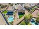Aerial view of a home featuring solar panels, a pool, and artificial grass at 41734 N Cielito Linda Way, San Tan Valley, AZ 85140