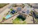 Aerial view of a home featuring solar panels, a pool, and artificial grass at 41734 N Cielito Linda Way, San Tan Valley, AZ 85140