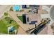 An aerial view of a backyard including a pool, desert landscaping, and solar panels at 41734 N Cielito Linda Way, San Tan Valley, AZ 85140