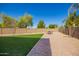 Spacious backyard with green grass, pavers, and gravel at 41734 N Cielito Linda Way, San Tan Valley, AZ 85140