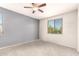 Bedroom with large windows and neutral carpet at 41734 N Cielito Linda Way, San Tan Valley, AZ 85140