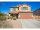 Two-story home with a brown two-car garage, desert landscaping and a brown roof at 41734 N Cielito Linda Way, San Tan Valley, AZ 85140