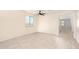 Spacious living room with tile floors and ceiling fan at 41734 N Cielito Linda Way, San Tan Valley, AZ 85140