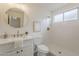 Elegant bathroom features a modern vanity, round mirror, and a walk-in shower at 4545 N 67Th Ave # 1106, Phoenix, AZ 85033