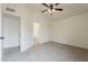 A well-lit bedroom features neutral carpet, a ceiling fan, and access to a bathroom and closet at 4545 N 67Th Ave # 1106, Phoenix, AZ 85033