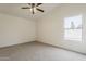 Spacious bedroom featuring neutral carpet and ample natural light through a window at 4545 N 67Th Ave # 1106, Phoenix, AZ 85033
