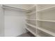 Organized closet featuring built-in shelves and a hanging rod at 4545 N 67Th Ave # 1106, Phoenix, AZ 85033