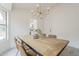 Dining area featuring a rustic table with seating for four, and views into the kitchen at 4545 N 67Th Ave # 1106, Phoenix, AZ 85033