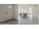 Bright dining room featuring a stylish table, a modern chandelier, and wood-look flooring at 4545 N 67Th Ave # 1106, Phoenix, AZ 85033