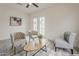 Bright living area with neutral walls, light wood-look floors, and decorative touches at 4545 N 67Th Ave # 1106, Phoenix, AZ 85033