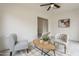 Cozy living area with a neutral palette, ceiling fan, and decorative furnishings on wood-look flooring at 4545 N 67Th Ave # 1106, Phoenix, AZ 85033