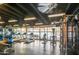 Well-equipped fitness center with treadmills, weights, and large windows overlooking the outdoors at 4750 N Central Ave # 3B, Phoenix, AZ 85012