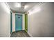 Apartment hallway showing a blue door and a green door at 4750 N Central Ave # 3B, Phoenix, AZ 85012