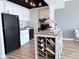 Bright kitchen featuring stainless steel appliances, white cabinetry, and a stylish kitchen island at 4750 N Central Ave # 3B, Phoenix, AZ 85012