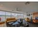 Bright living room featuring stylish seating, a modern fireplace, and expansive windows showcasing city views at 4750 N Central Ave # 3B, Phoenix, AZ 85012