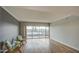 Bright living space featuring laminate floors, outdoor access, and two cushioned chairs at 4750 N Central Ave # 3B, Phoenix, AZ 85012