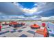 Relaxing rooftop deck with outdoor seating, offering panoramic views of the city and mountains on a cloudy day at 4750 N Central Ave # 3B, Phoenix, AZ 85012