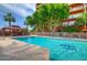 Beautiful swimming pool area featuring comfortable lounge chairs, a shaded gazebo, and a view of the surrounding building at 4750 N Central Ave # 3B, Phoenix, AZ 85012