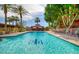 Inviting community swimming pool surrounded by lush greenery, lounge chairs, and a shaded gazebo at 4750 N Central Ave # 3B, Phoenix, AZ 85012