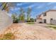 Large backyard featuring gravel, mature trees, and a partial view of the home at 4831 N 93Rd Dr, Phoenix, AZ 85037