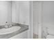 Bathroom featuring a granite countertop, chrome faucet, and tile floors at 4831 N 93Rd Dr, Phoenix, AZ 85037