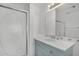 Cozy bathroom featuring a shower with patterned glass and a vanity with a marble countertop at 4831 N 93Rd Dr, Phoenix, AZ 85037