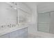 Bathroom showcasing a sink with a light blue vanity and granite countertop at 4831 N 93Rd Dr, Phoenix, AZ 85037